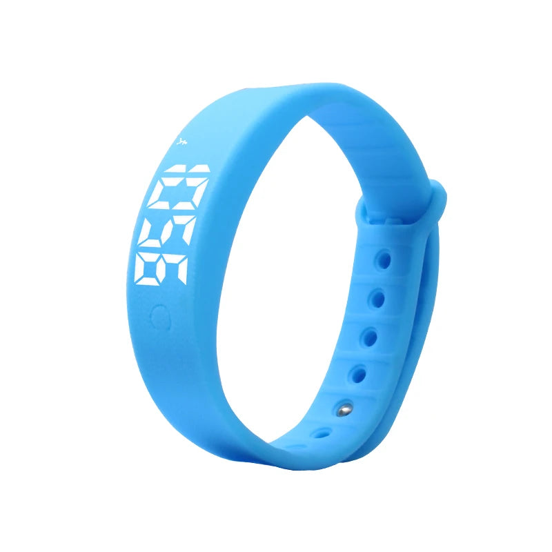 NOVIQ Wake silent vibration alarm wristband in blue, LED time display lit on the strap